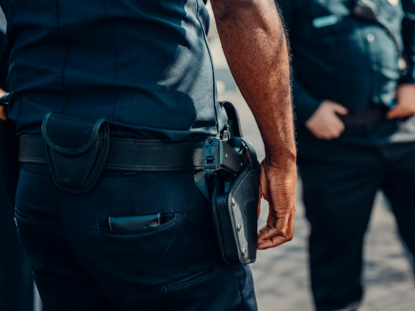 A policeman arresting a criminal.
